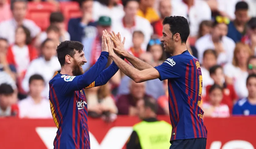 Busquets y Messi